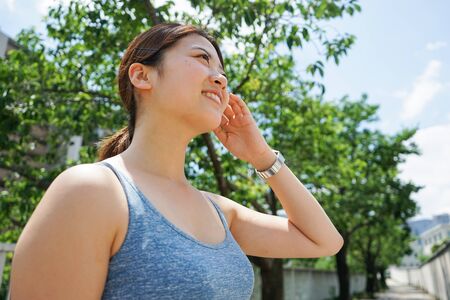 Young woman getting sweaty outdoorsの写真素材