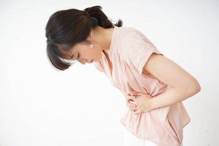 Young woman suffering from a stomachacheの写真素材