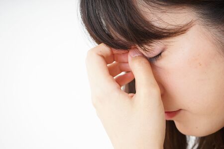 Young woman suffering from a headacheの写真素材
