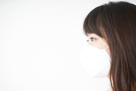 Young woman wearing a maskの写真素材