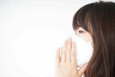 Young woman wearing a maskの写真素材