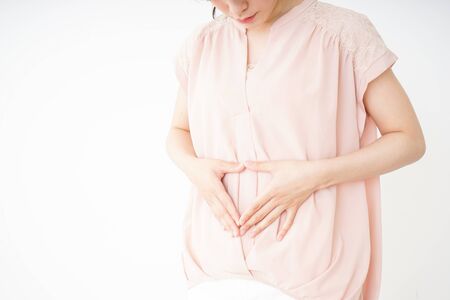 Young woman becoming pregnantの写真素材