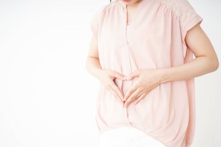 Young woman becoming pregnantの写真素材