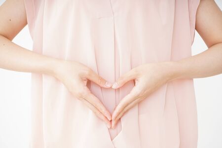 Young woman becoming pregnantの写真素材