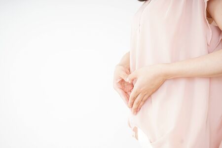 Young woman becoming pregnantの写真素材