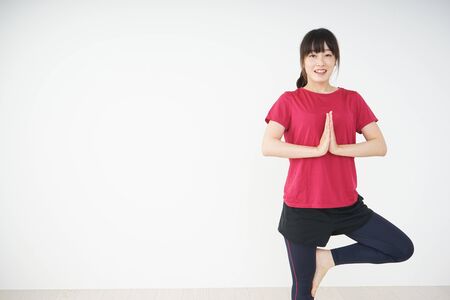 Young woman stretchingの写真素材