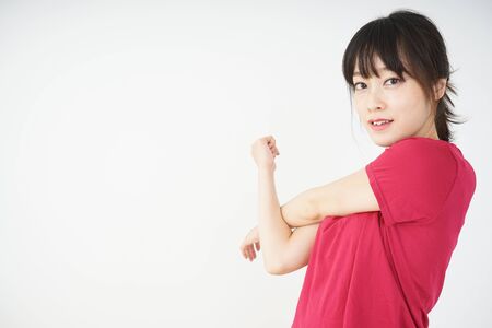 Young woman stretchingの写真素材