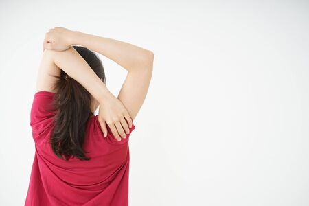 Young woman stretchingの写真素材
