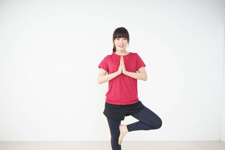 Young woman stretchingの写真素材
