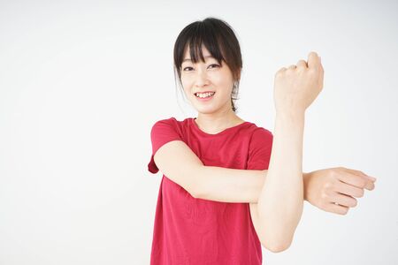Young woman stretchingの写真素材