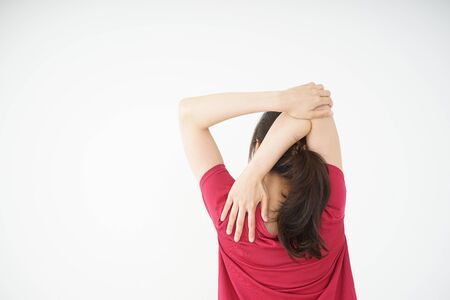 Young woman stretchingの写真素材