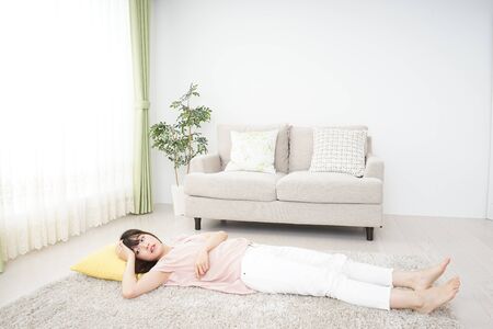 Young woman sleeping at homeの写真素材