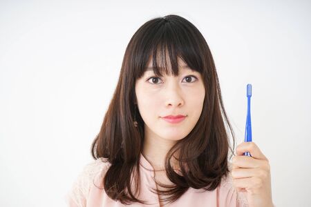 Young woman brushing_her teethの写真素材
