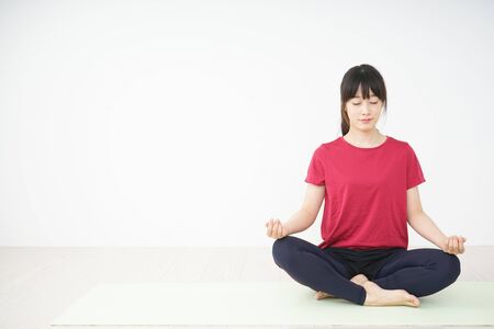 Young woman doing yogaの写真素材