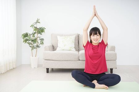 Young woman doing yogaの写真素材