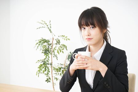 Business woman relaxing at cafeの写真素材