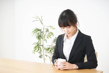 Business woman relaxing at cafeの写真素材