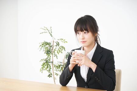 Business woman relaxing at cafeの写真素材