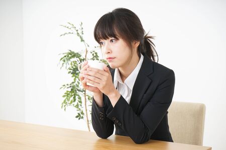Business woman relaxing at cafeの写真素材
