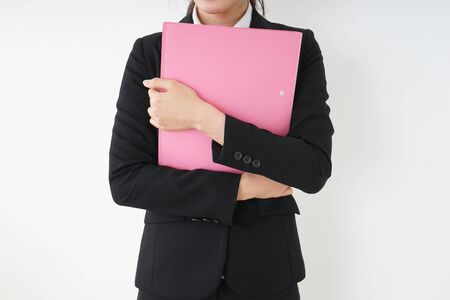 Young woman having some documents at officeの写真素材