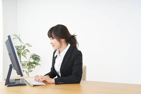 Businesswoman using a computer at officeの写真素材