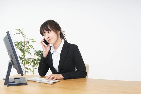 Businesswoman doing a deskwork at officeの写真素材