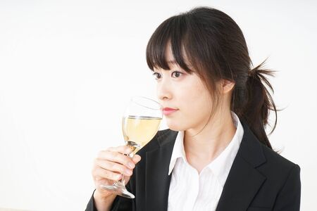 Woman drinking Alcoholics with suitの写真素材