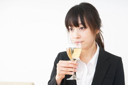 Woman drinking Alcoholics with suitの写真素材