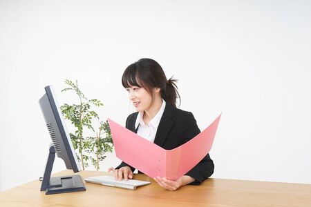 Businesswoman doing a deskwork at officeの写真素材