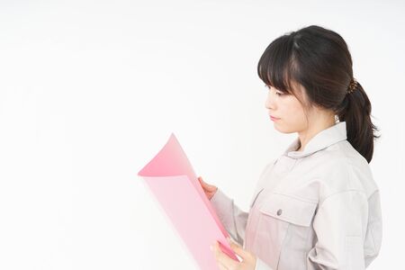 Woman working with uniformの写真素材