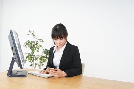 Businesswoman doing a deskwork at officeの写真素材