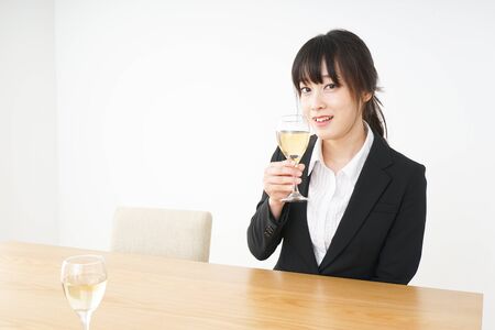 Woman drinking Alcoholics with suitの写真素材