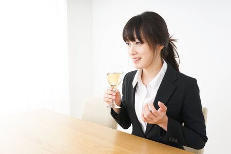 Woman drinking Alcoholics with suitの写真素材