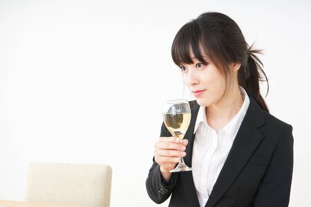 Woman drinking Alcoholics with suitの写真素材