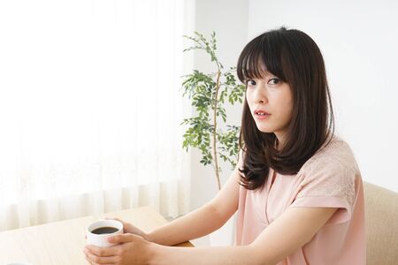 Young woman relaxed at cafeの写真素材