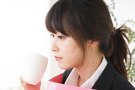 Businesswoman doing a deskwork at officeの写真素材