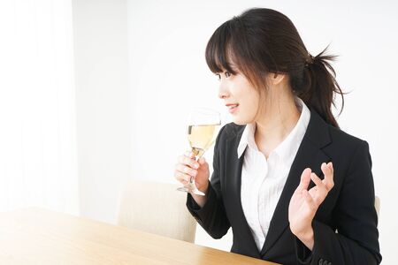 Woman drinking Alcoholics with suitの写真素材