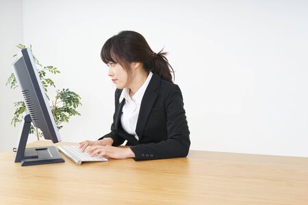 Businesswoman using a computer at officeの写真素材