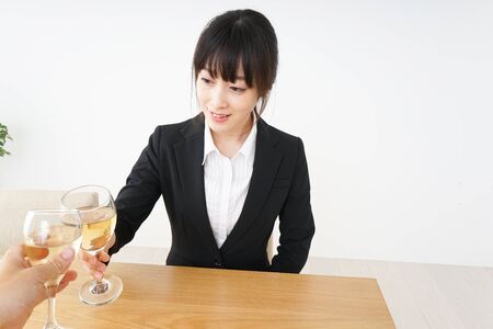 Woman drinking Alcoholics with suitの写真素材