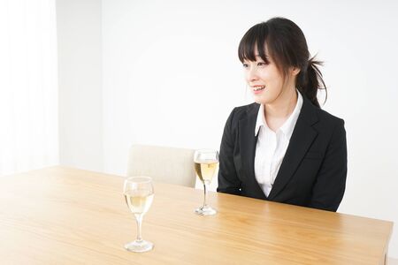 Woman drinking Alcoholics with suitの写真素材