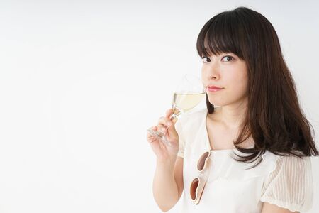 Young woman drinking wineの写真素材