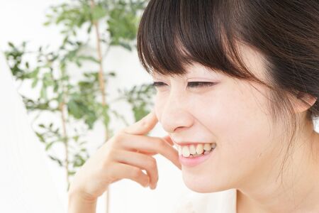 Young woman doing skin careの写真素材