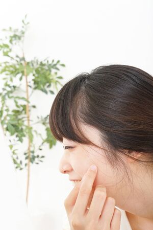 Young woman doing skin careの写真素材
