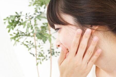 Young woman doing skin careの写真素材