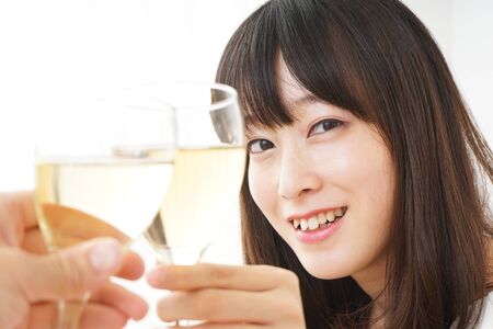 Young woman drinking wineの写真素材