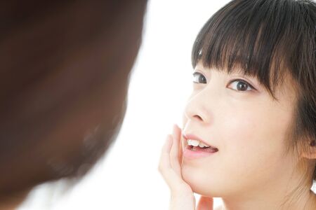Young woman doing skin careの写真素材