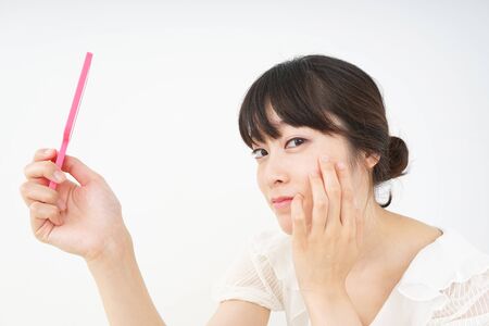 Young woman doing skin careの写真素材