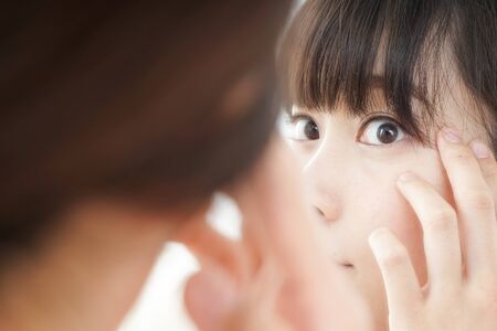 Young woman doing skin careの写真素材