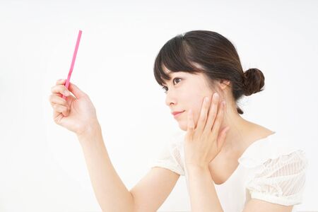 Young woman doing skin careの写真素材