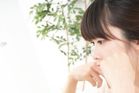 Young woman doing skin careの写真素材